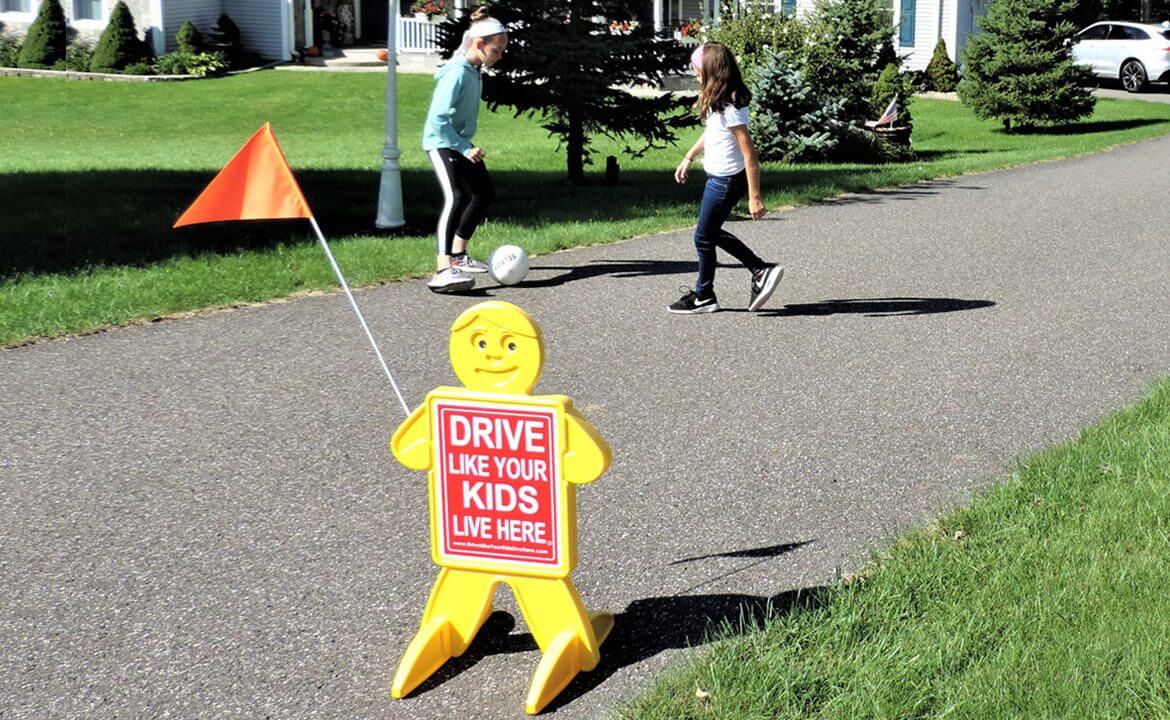 Two Children Playing Near Drive Like Your Kids Live Here Indicator